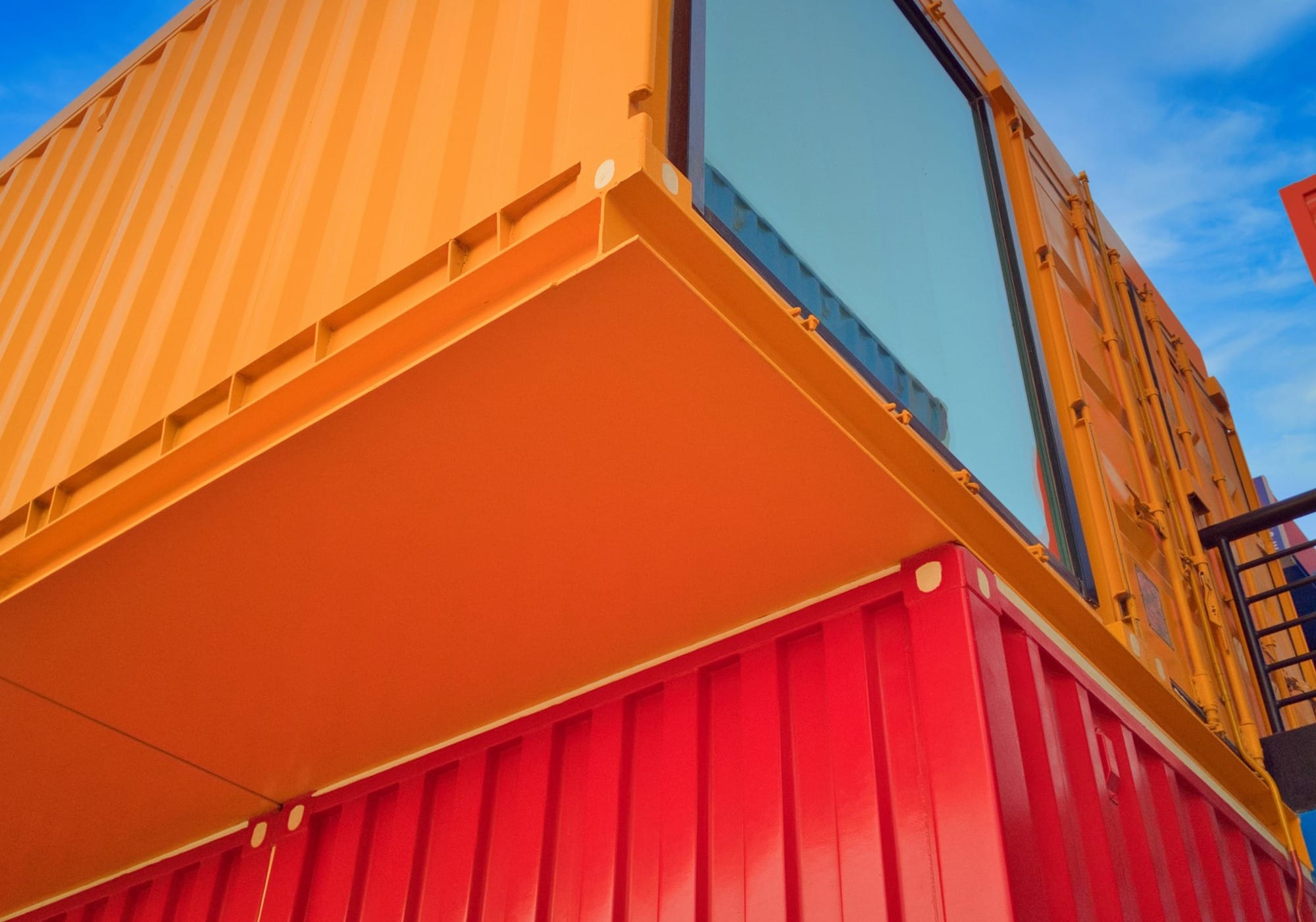 yellow and red wooden building under blue sky during daytime