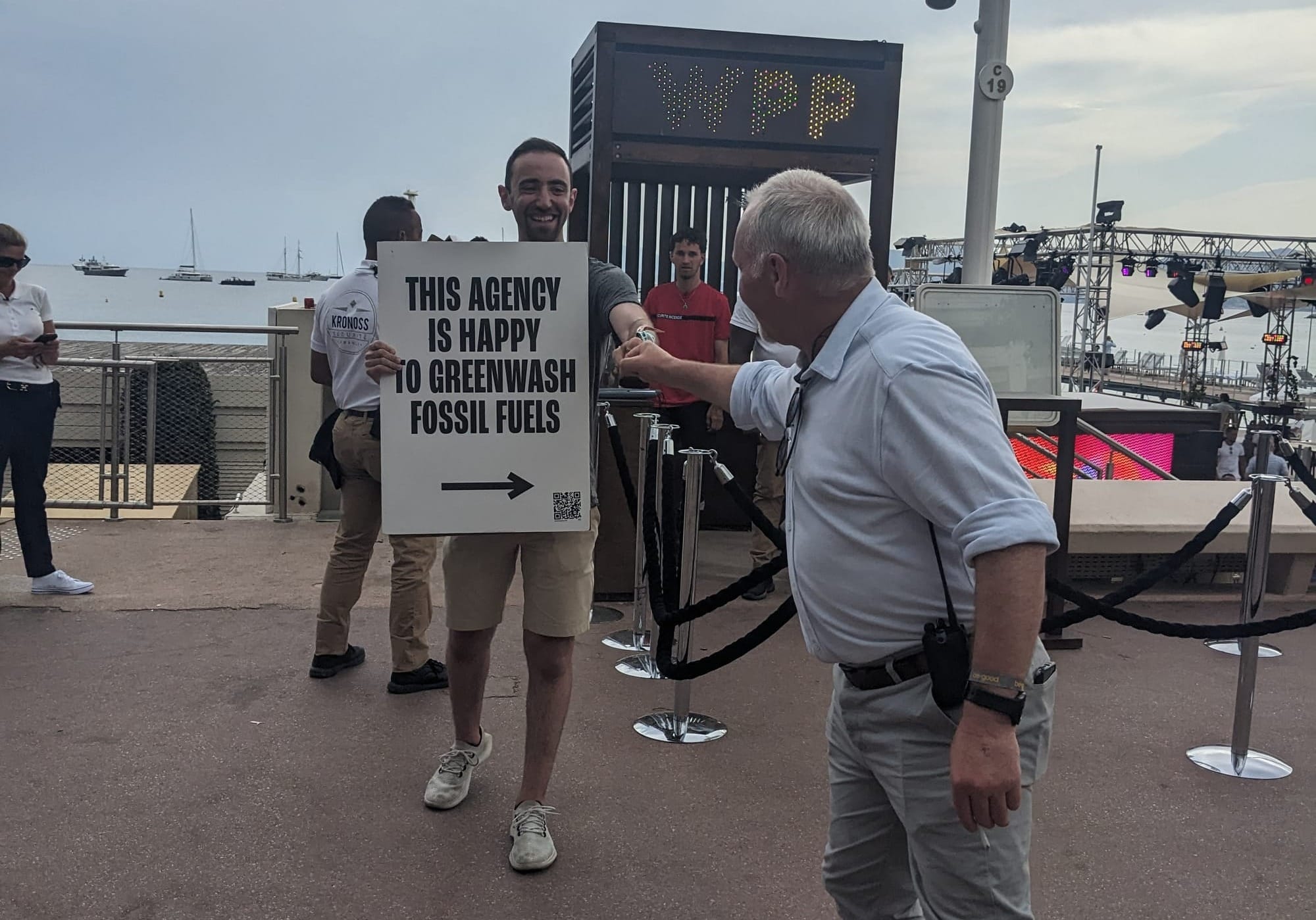 Jacob protesting WPP fist-bumping a security guard