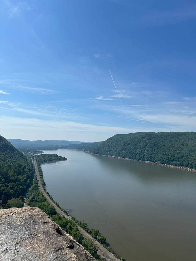 A river and mountains with trees