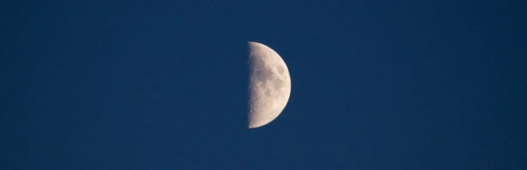Half of the moon on a blue background