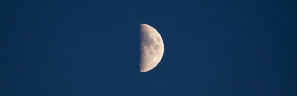 Half of the moon on a blue background